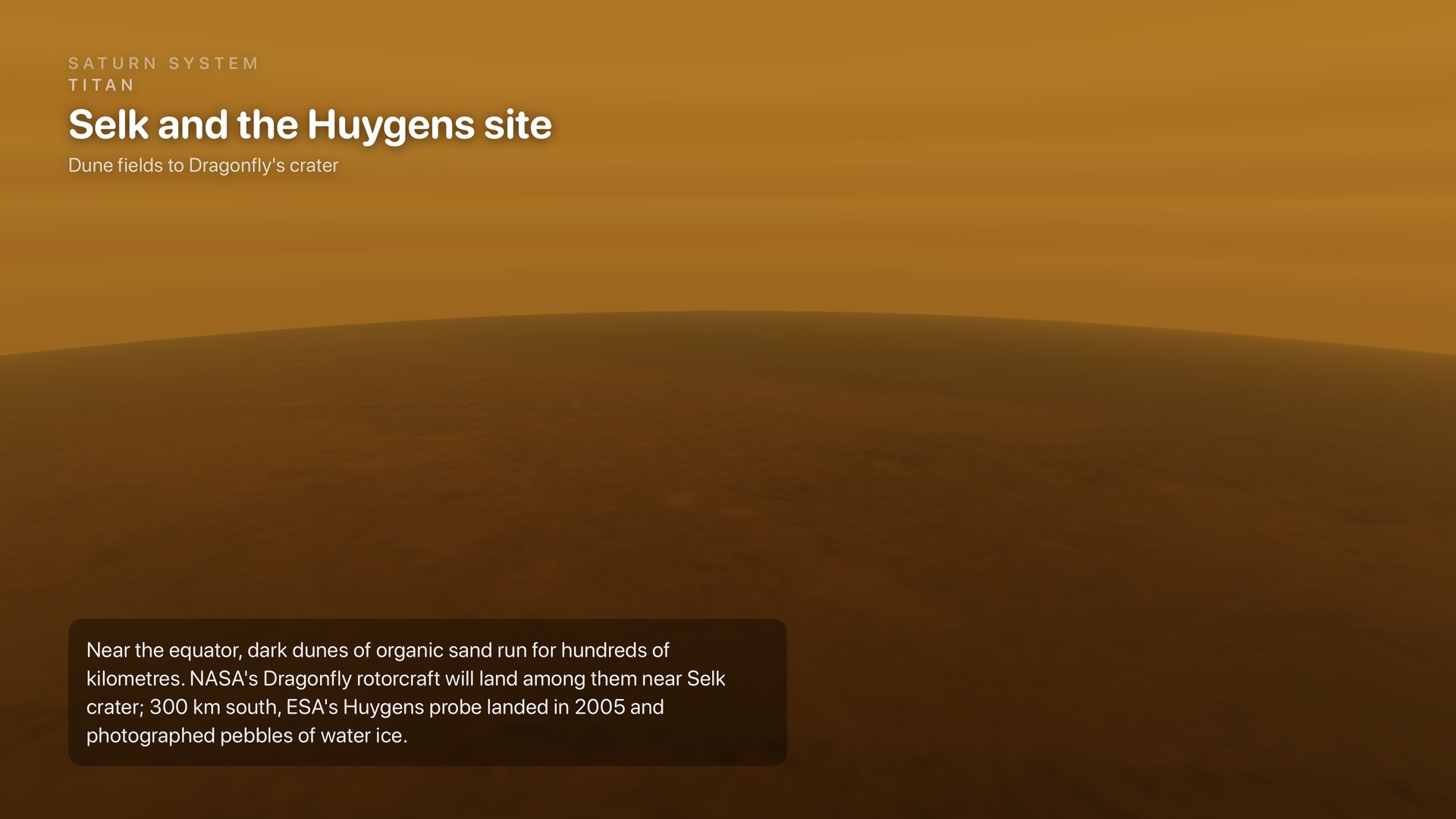 A low flight through Titan's orange haze over the dune fields near Selk crater